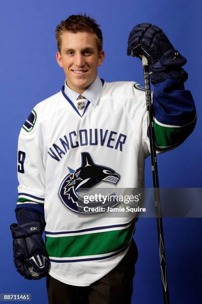 Jordan Schroeder of the Vancouver Canucks poses for a photo after he was selected overall by the Canucks during the first round of the 2009 NHL Entry...