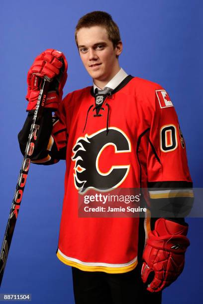 Tim Erixon of the Calgary Flames poses for a photo after he was selected overall by the Flames during the first round of the 2009 NHL Entry Draft at...