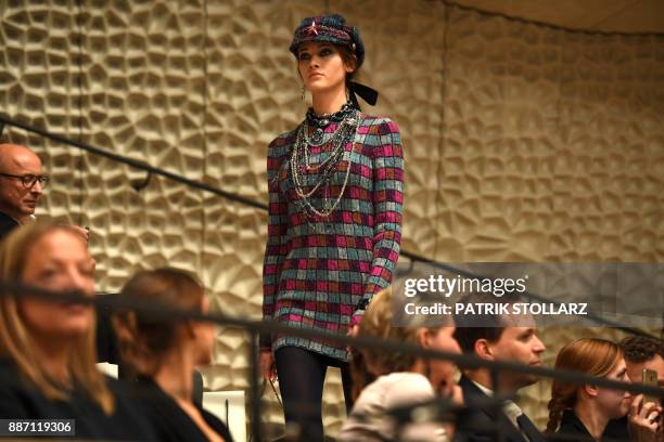 Model presents a creation the "Chanel Metiers d'Art" fashion show at the Elbphilarmonie in Hamburg, nothern Germany, on December 6, 2017.