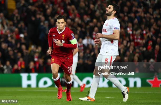 Philippe Coutinho of Liverpool celebrates after scoring his sides first goal during the UEFA Champions League group E match between Liverpool FC and...