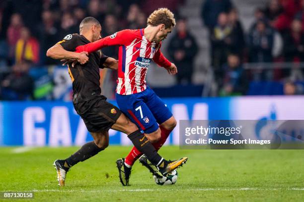Antoine Griezmann of Atletico de Madrid flights with the ball with Hector Moreno of AS Roma during the UEFA Champions League 2017-18 match between...