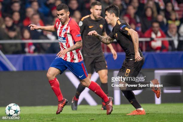 Antoine Griezmann of Atletico de Madrid flights with Aleksandar Kolarov of AS Roma for the ball during the UEFA Champions League 2017-18 match...