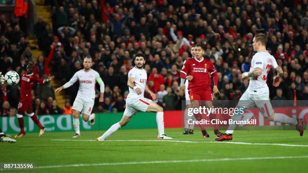 Roberto Firmino of Liverpool scores his sides third goal during the UEFA Champions League group E match between Liverpool FC and Spartak Moskva at...