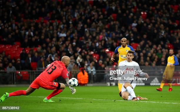 Fernando Llorente of Tottenham Hotspur scores his sides first goal past Nauzet Perez of Apoel FC during the UEFA Champions League group H match...