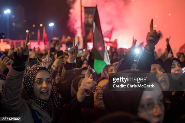 Protesters wave flags and shout slogans outside the U.S. Consulate on December 6, 2017 in Istanbul, Turkey. People gathered to protest after U.S...