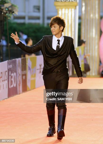 Taiwanese pop singer Alan Lo waves on the red carpet of the 20th Golden Melody Awards in Taipei on June 27, 2009. Performers from Taiwan, Hong Kong,...