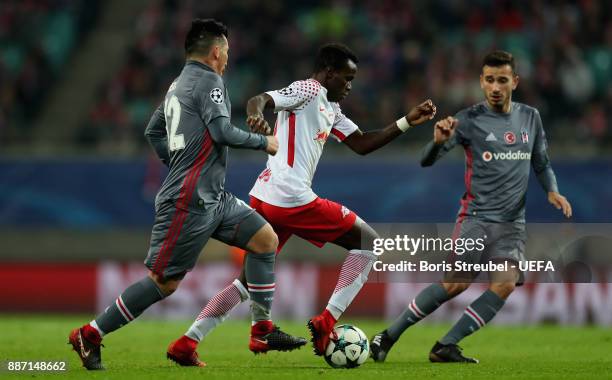 Bruma of RB Leipzig is challenged by Gary Medel of Besiktas Istanbul during the UEFA Champions League group G match between RB Leipzig and Besiktas...