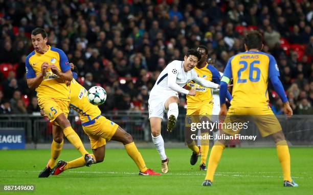 Heung-Min Son of Tottenham Hotspur shoots and scores his teams second goal during the UEFA Champions League group H match between Tottenham Hotspur...