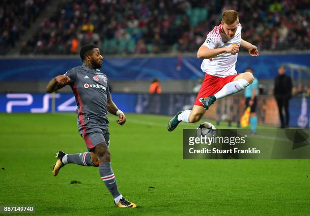 Marcel Halstenberg of RB Leipzig crosses while under pressure from Jeremain Lens of Besiktas during the UEFA Champions League group G match between...