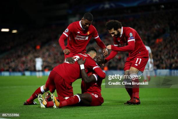 Sadio Mane of Liverpool celebrates scoring the 4th Liverpool goal with team mates during the UEFA Champions League group E match between Liverpool FC...