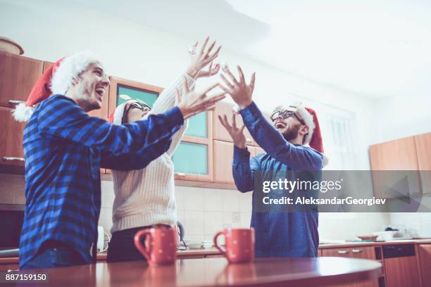 group of people having fun by throwing candy in the air - throwing cake stock pictures, royalty-free photos & images