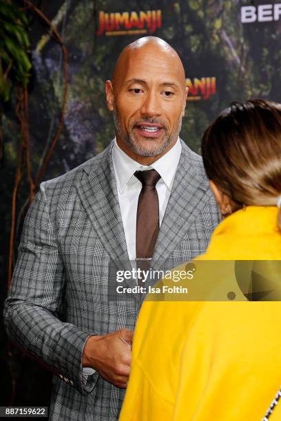 Senna Gammour and US actor Dwayne Johnson attend the German premiere of 'Jumanji: Willkommen im Dschungel' at Sony Centre on December 6, 2017 in...