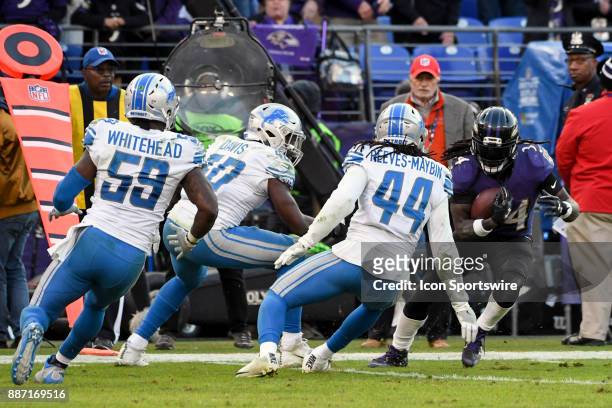 Baltimore Ravens running back Alex Collins in action against Detroit Lions linebacker Jarrad Davis , outside linebacker Tahir Whitehead and...
