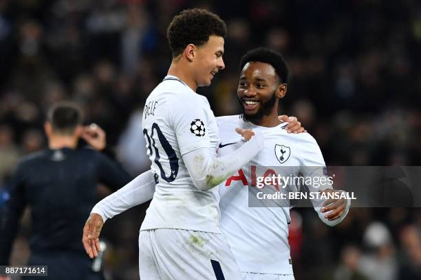 Tottenham Hotspur's French midfielder Georges-Kevin N'Koudou vies with Tottenham Hotspur's English midfielder Dele Alli after scoring their third...