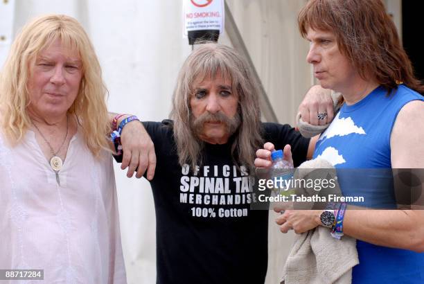 David St. Hubbins, Derek Smalls and Nigel Tufnel of Spinal Tap poses in the backstage area at Glastonbury Festival Site on June 27, 2009 in...