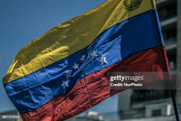 Venezuela flag is seen during a demonstration to the streets of Caracas, Venezuela on November 30, 2017 to protest against the country's lack of...