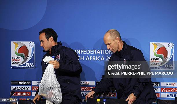 National football team's Landon Donovan and coach Bob Bradley leave a press conference at Ellis Park stadium in Johannesburg on June 27, 2009 on the...