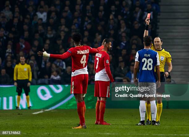 Referee Jonas Eriksson shows red card to Rachid Ghezzal of AS Monaco and Felipe Augusto de Almeida of FC Porto during the UEFA Champions League group...