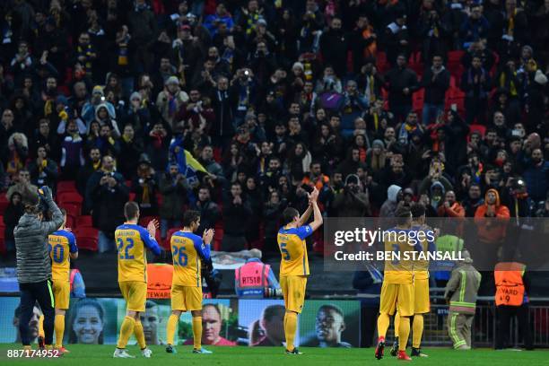 Apoel players applaud their supporters after the UEFA Champions League Group H football match between Tottenham Hotspur and Apoel Nicosia at Wembley...