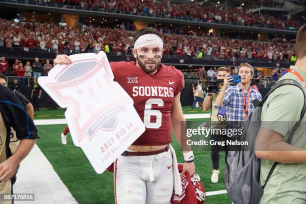 Big 12 Championship: Oklahoma QB Baker Mayfield victorious holding up Bif 12 sign after winning game vs Texas Christian at AT&T Stadium. Dallas, TX...