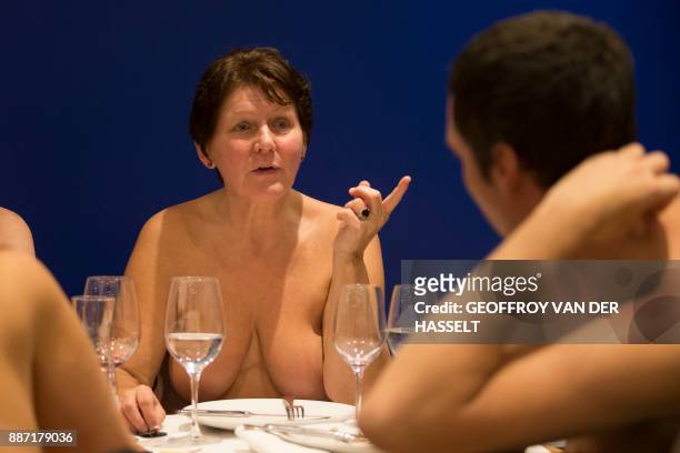 Graphic content / Diners chat in the nude at the newly opened nudist restaurant "o'naturel" in Paris on December 5, 2017. - Leave your coats, your...