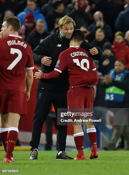 Philippe Coutinho with Jurgen Klopp manager of Liverpool with the match ball after scoring a hat-rick during the UEFA Champions League group E match...