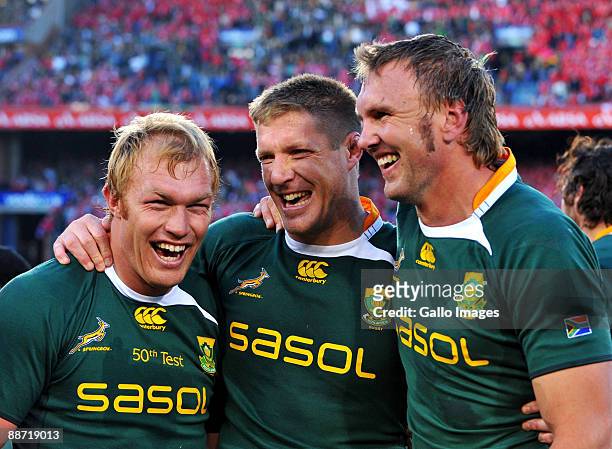 Schalk Burger, Bakkies Botha and Andries Bekker of South Africa celebrate their series win after the Second Test match between South Africa and the...
