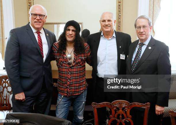 Rep. Joe Crowley , Slash of Guns N' Roses, Producer Mike Clink and Committee Chairman Rep. Bob Goodlatte pose for a photo before the SLASH Holiday...