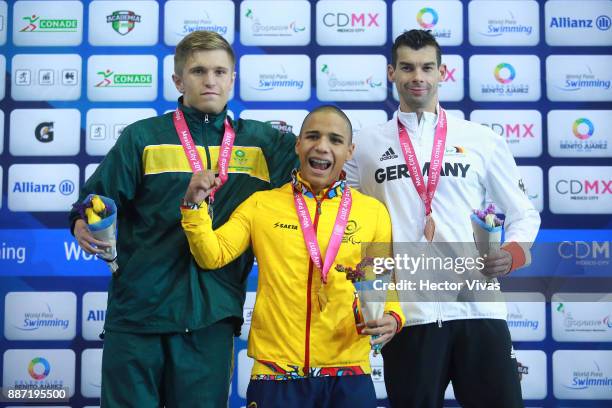 Christian Sadie of South Africa silver medal, Carlos Serrano of Colombia gold medal and Tobias Pollap of Germany bronze medal in Men's 50m Freestyle...