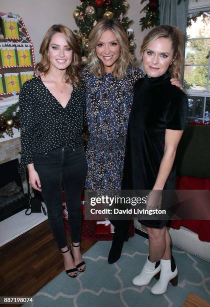 Actresses Merritt Patterson and Maggie Lawson pose with host Debbie Matenopoulos at Hallmark's "Home & Family" at Universal Studios Hollywood on...