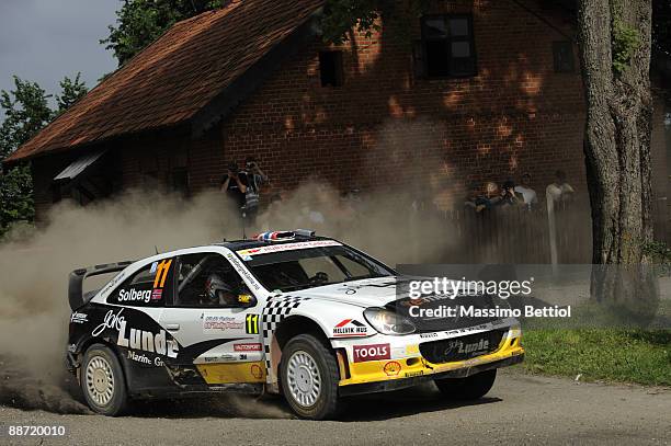 Petter Solberg of Norway and Phill Mills of Great Britain compete in their Citroen Xsara during the Leg 2 of WRC Rally of Poland on June 27, 2009 in...