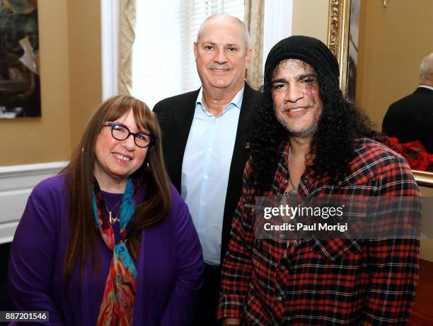 Diane Blagman of The Recording Academy, Producer Mike Clink and Slash of Guns N' Roses pose for a photo prior to the SLASH Holiday Reception hosted...