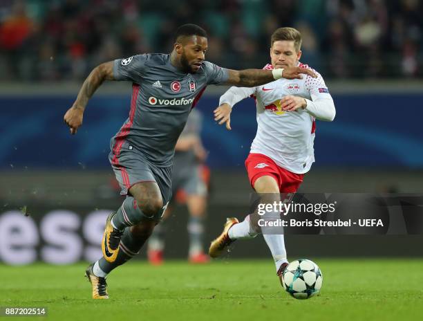 Dominik Kaiser of RB Leipzig is challenged by Jeremain Lens of Besiktas Istanbul during the UEFA Champions League group G match between RB Leipzig...