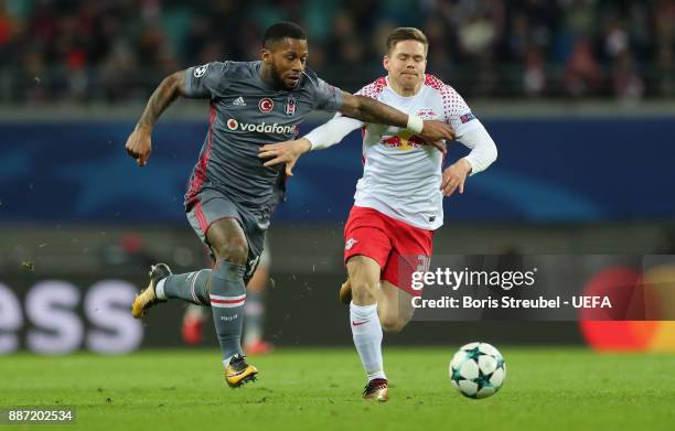 Dominik Kaiser of RB Leipzig is challenged by Jeremain Lens of Besiktas Istanbul during the UEFA Champions League group G match between RB Leipzig...