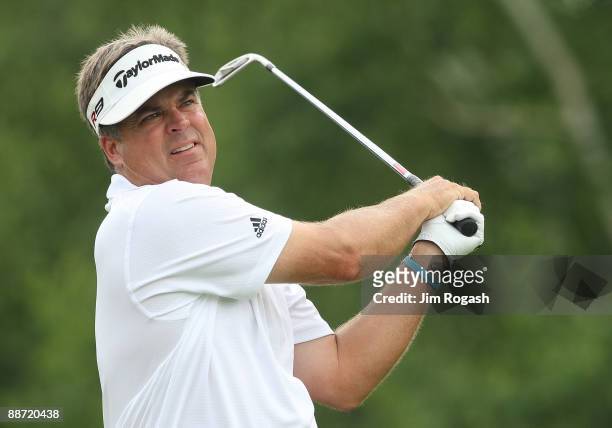 Kenny Perry reacts after a birdie putt on the 9th green during round three of the 2009 Travelers Championship at TPC River Highlands on June 27, 2009...