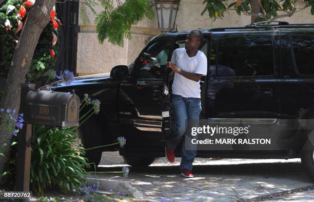 An unidentified man arrives at the rented Holmby Hills home of music legend Michael Jackson after his recent death, in Los Angeles on June 27, 2009....