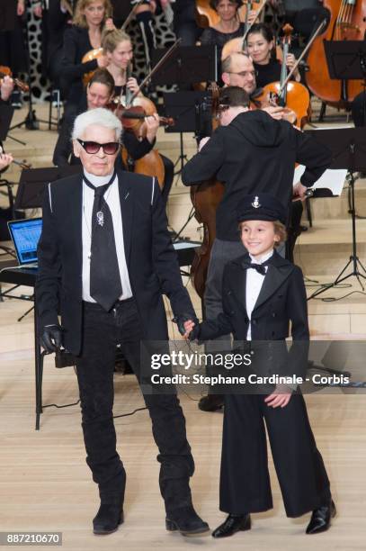 Karl Lagerfeld and Hudson Kroenig walk the runway during the Chanel Collection Metiers d'Art Paris Hamburg 2017/18 at the Elbphilharmonie on December...
