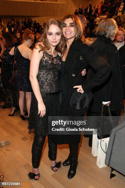 Lily-Rose Depp and Carine Roitfeld during the Chanel "Trombinoscope" collection Metiers d'Art 2017/18 show at Elbphilharmonie on December 6, 2017 in...