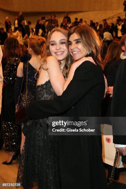 Lily-Rose Depp and Carine Roitfeld during the Chanel "Trombinoscope" collection Metiers d'Art 2017/18 show at Elbphilharmonie on December 6, 2017 in...