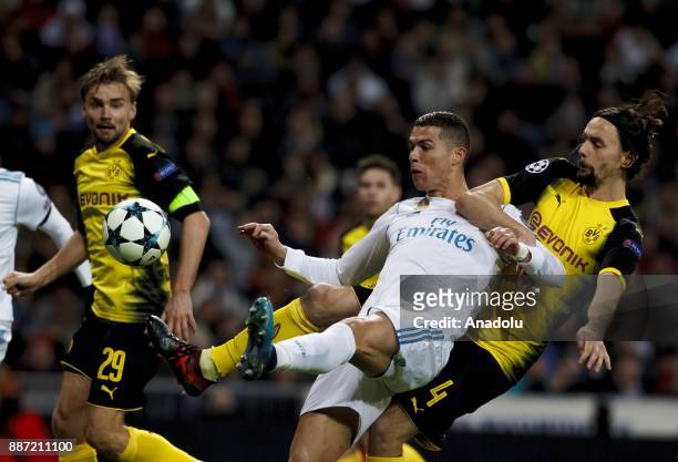 Cristiano Ronaldo of Real Madrid in action against Neven Subotic of Borussia Dortmund during the UEFA Champions League group H match between Real...