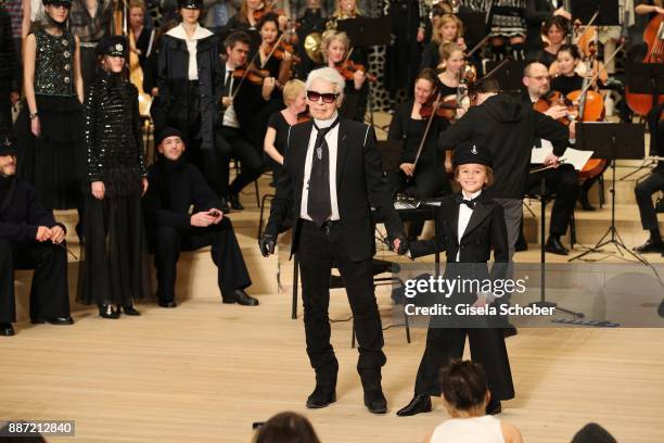 Fashion designer Karl Lagerfeld and Hudson Kroenig during the Chanel "Trombinoscope" collection Metiers d'Art 2017/18 show at Elbphilharmonie on...