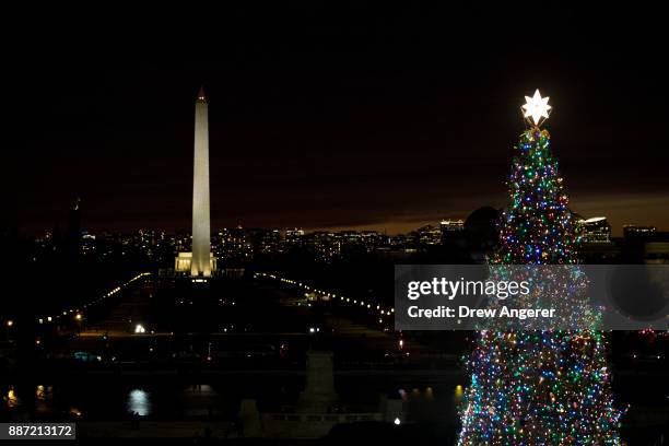 View of the Washington Monument and Capitol Christmas tree after the U.S. Capitol Christmas Tree lighting ceremony on Capitol Hill, December 6, 2017...