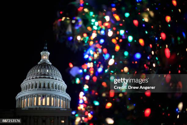 View of the U.S. Capitol during the U.S. Capitol Christmas Tree lighting ceremony on Capitol Hill, December 6, 2017 in Washington, DC. The tree is a...