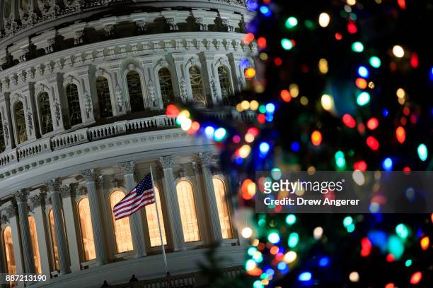 View of the U.S. Capitol during the U.S. Capitol Christmas Tree lighting ceremony on Capitol Hill, December 6, 2017 in Washington, DC. The tree is a...