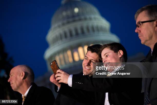 Speaker of the House Paul Ryan takes a 'selfie' photograph with Ridley Brandmayr, the 11-year-old from Bozeman, Montana who was chosen to light the...