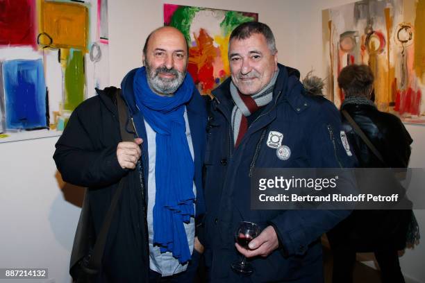 Cedric Klapisch and Jean-Marie Bigard attend painter Caroline Faindt Exhibition Opening at "L'Espace Reduit" on December 6, 2017 in Paris, France.