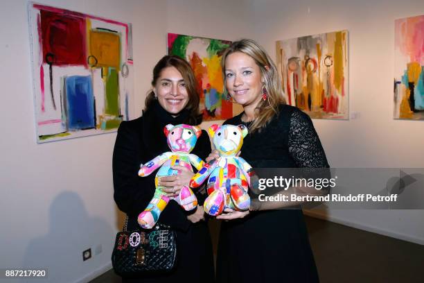 Caterina Murino and Caroline Faindt attend painter Caroline Faindt Exhibition Opening at "L'Espace Reduit" on December 6, 2017 in Paris, France.