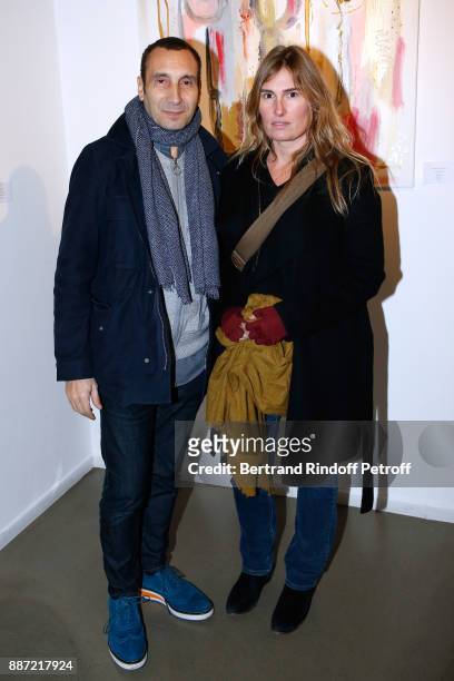 Actors Zinedine Soualem and Lola Doillon attend painter Caroline Faindt Exhibition Opening at "L'Espace Reduit" on December 6, 2017 in Paris, France.