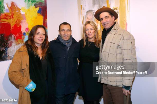 Actress Dounia Coesens, actor Zinedine Soualem, his companion Caroline Faindt and actor Simon Abkarian attend painter Caroline Faindt Exhibition...