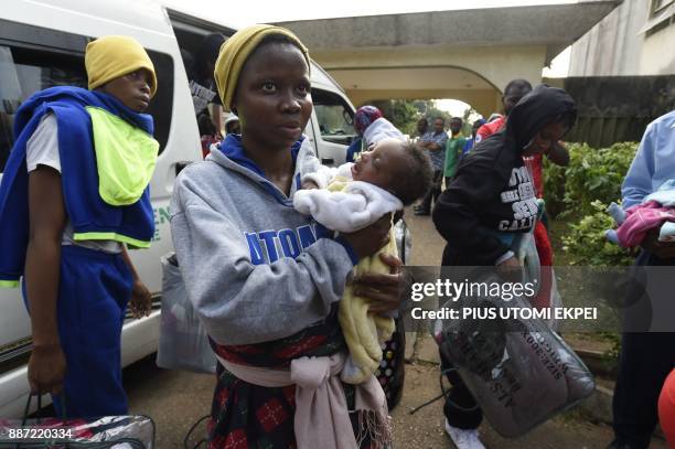 Migrants from Edo State brought home from Libya arrive in Benin, capital of Edo State in midwest Nigeria on December 6, 2017. Out of over 400...